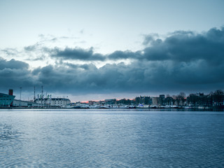 Fototapeta na wymiar Amsterdam Port city shape during sunrise