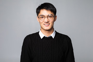 Obraz premium Chinese handsome man smiling and laughing isolated on white background