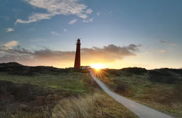 Poster de jardin Mer du Nord, Pays-Bas road to red lighthouse at sunrise