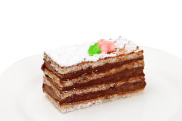 A piece of sponge cake on white plate