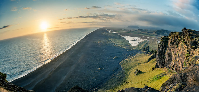 Aeria view of Dyrholaey beach Vik village in Iceland. Scenic image of famous tourist attraction.