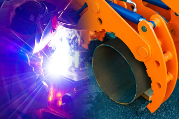 Replacing water pipes in the city. Machine for laying pipes and a welder. Elimination of municipal...