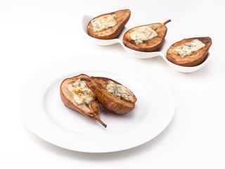 baked pears with honey and cheese on a white plate