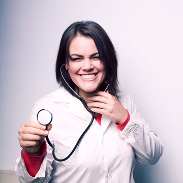 portrait of young smiling doctor with stethoscope