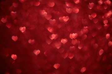 Red hearts bokeh as background. Love, wedding or Valentine's day background