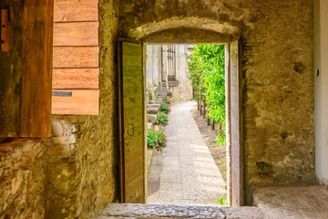 Picturesque small town street view in Limone, Lake Garda Italy. Entrance of an apartment or house.