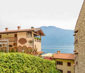 Nice mediterranean house roofs with different colours in Limone, Garda, Italy.