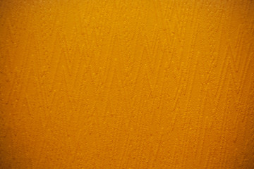 Orange wall. Abstract stucco wall texture in bright orange colors.