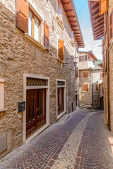 Picturesque small town street view in Limone, Lake Garda Italy.