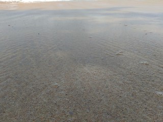 Wave and sand in the beautiful beach