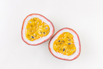 Closeup ripe juicy passion fruit close-up. The concept of exotic fruits, wholesome organic food, vegetarianism. Light pastel background.