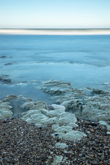 Waves over a rocky shore in Flamborough at North Landing