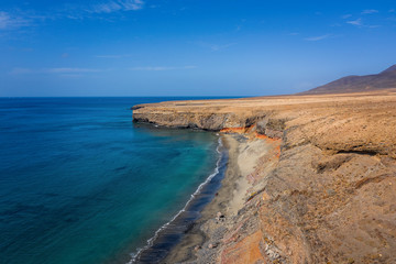 Morro Jable, Spain, october 2019: Morro Jable coastline with trasparent water. Aerial drone view.