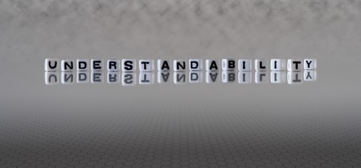 understandability concept represented by wooden letter tiles