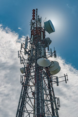 cell phone tower partial silo with sun