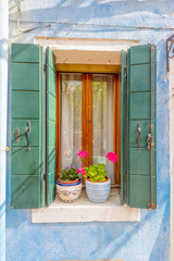 Beautiful window decorated with flowers in italy