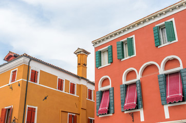 Fototapeta premium Beautiful window decorated with flowers in Italy