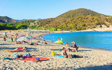 People on Chia beach at Mediterranian Sea Sardinia