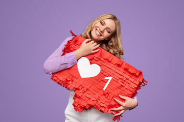 Happy female hugging red banner with social media like sign