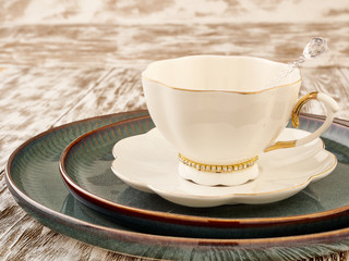 Porcelain coffee cups and saucers on a light background
