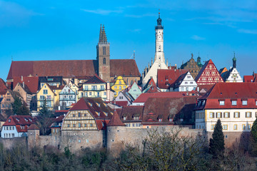 Aerial view of town wall, quaint colorful facades and roofs of medieval old town of Rothenburg ob der Tauber, Bavaria, Germany