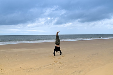A man doing some exercise workout in the beach