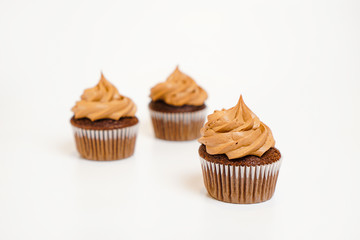 Three chocolate cupcakes