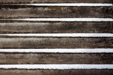 Slate background with snow lying on it