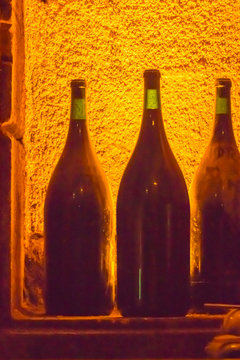 Wine Bottles Backlit in a Wine caveau in Beaune France