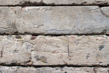 Old concrete blocks wall background closeup