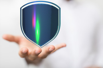 shield protection concept holding in hand