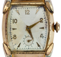 Isolated old analog gold wristwatch face.