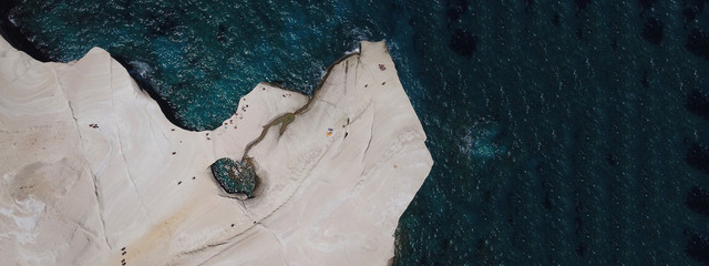 Aerial drone ultra wide photo of beautiful white chalk volcanic rocky beach of Sarakiniko, Milos island, Cyclades, Greece