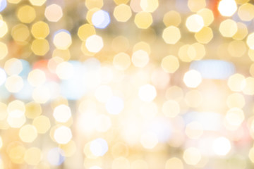 Gold bokeh lights. Abstract glitter festive blur background. Christmas and New Year holidays backdrop