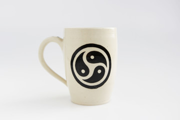 white clay mug with trixel - a symbol of bdsm