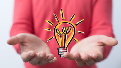 idea lamp concept in hand.