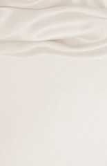 Smooth elegant golden silk or satin luxury cloth texture as wedding background. Luxurious background design. In Sepia toned. Retro style