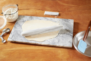 pastry dough with marble rolling pin