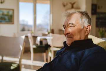 Portrait of senior man 80 years old caucasian pensioner grandfather sitting in chair at retirement...