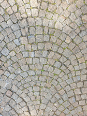 Top view of footpath tiles. Cobble Eath tone stone arrange as wave.