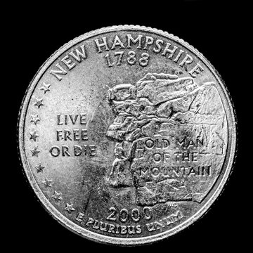 This quarter illustrates for the state of New Hampshire the official motto of the state which is Live Free or Die.