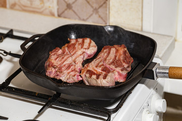 Raw beef steak in grill pan
