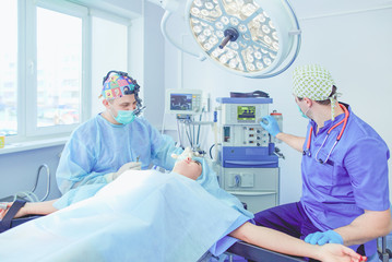 Man surgeon at work in operating room