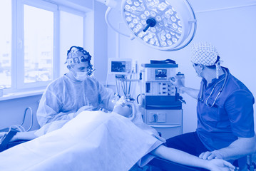 Man surgeon at work in operating room