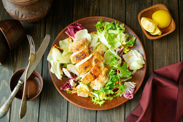 Salad of grilled chicken breast with zucchini and lettuce, top view image