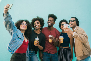 Multi-ethnic group of friends taking a selfie.