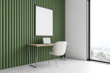 Green home office workplace, computer and poster