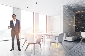 African man in stylish cafe interior