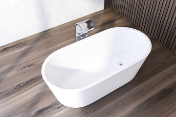 Top view of bathtub in white and wooden bathroom
