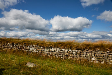Fototapeta na wymiar Hadrian's Wall historic roman tourist attraction in Northumberland in the North of England.